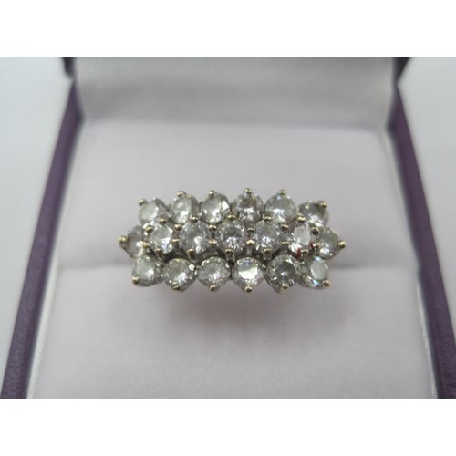 254 - 9 carat gold dress ring set with three rows of small white stones, ring size P/Q, gross weight of ri... 