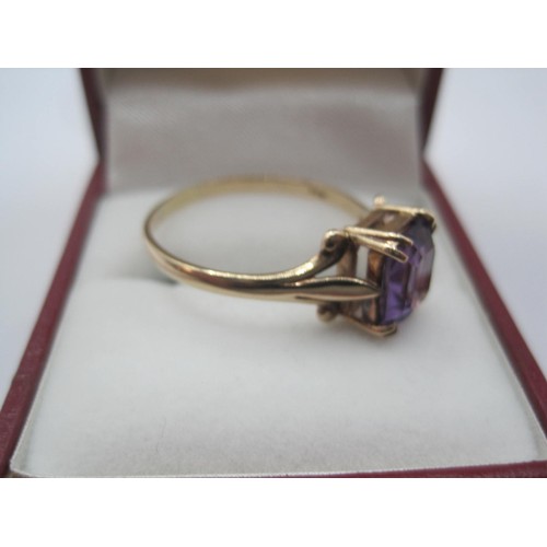 260 - A 9 carat gold amethyst ring, the rectangular cut amethyst estimated at 8.5mm x 6mm, ring size U/V, ... 