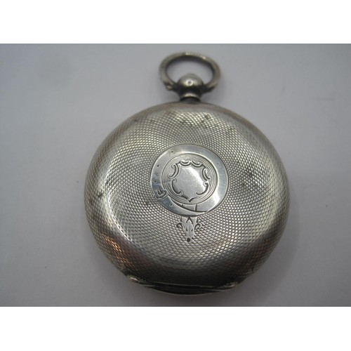 266 - A silver ladies pocket watch with foliate enamel dial and engine turning, key winding. The case with... 