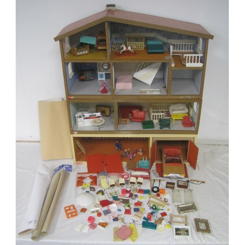 272 - A Lundby dolls house with garage unit, a large quantity of furniture and accessories, several dolls ... 