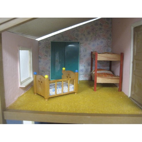 272 - A Lundby dolls house with garage unit, a large quantity of furniture and accessories, several dolls ... 