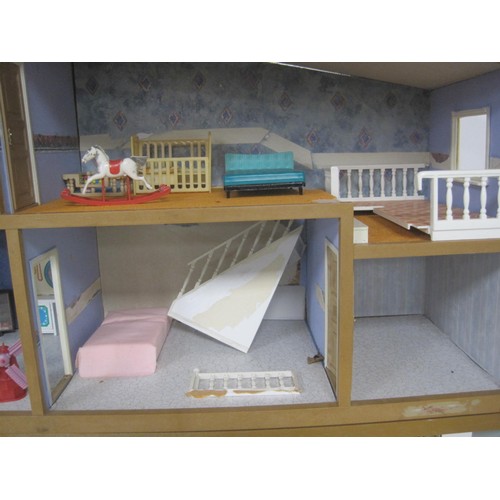 272 - A Lundby dolls house with garage unit, a large quantity of furniture and accessories, several dolls ... 