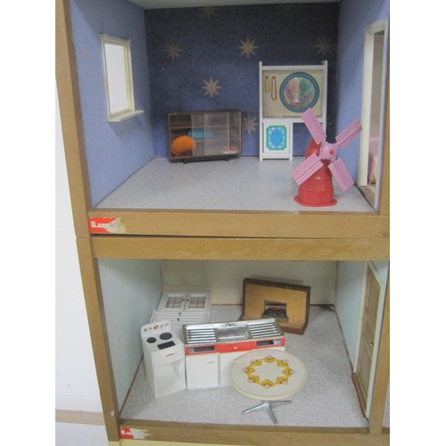 272 - A Lundby dolls house with garage unit, a large quantity of furniture and accessories, several dolls ... 