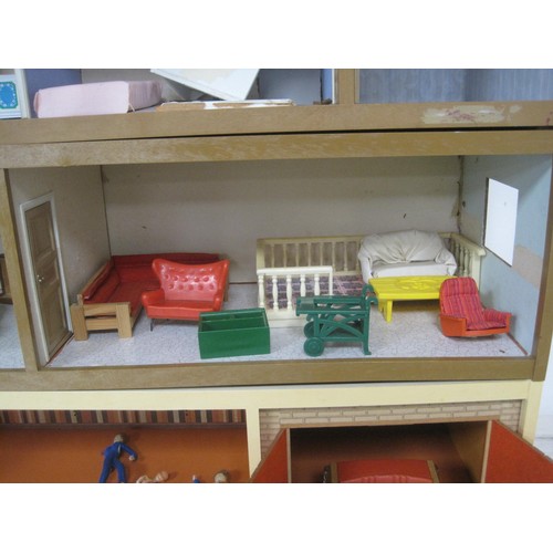 272 - A Lundby dolls house with garage unit, a large quantity of furniture and accessories, several dolls ... 