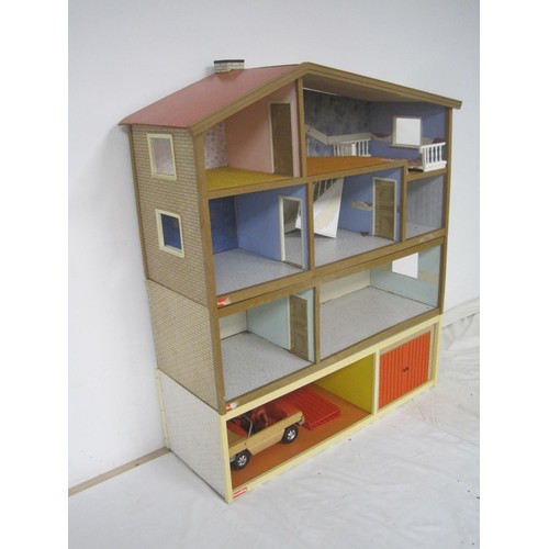 272 - A Lundby dolls house with garage unit, a large quantity of furniture and accessories, several dolls ... 