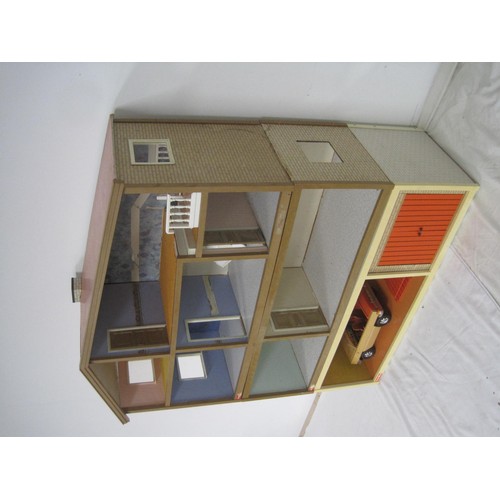 272 - A Lundby dolls house with garage unit, a large quantity of furniture and accessories, several dolls ... 