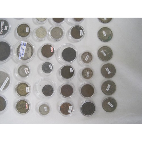 244A - A collection of about eighty-five coins, many of which are contained in capsules, including British ... 