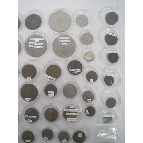 244A - A collection of about eighty-five coins, many of which are contained in capsules, including British ... 