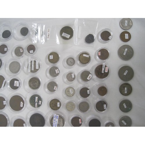 244A - A collection of about eighty-five coins, many of which are contained in capsules, including British ... 