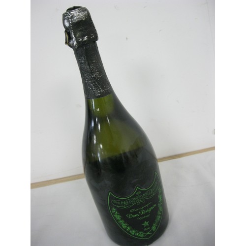 61 - A bottle of Dom Perignon Luminous Label 2010, sealed, luminous label works, storage wear to label an... 