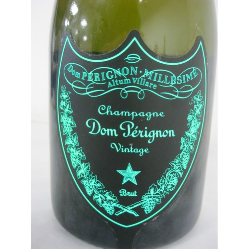 61 - A bottle of Dom Perignon Luminous Label 2010, sealed, luminous label works, storage wear to label an... 