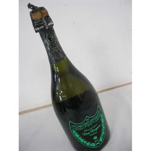 62 - A bottle of Dom Perignon Luminous Label 2010, sealed, luminous label works, storage wear to label an... 