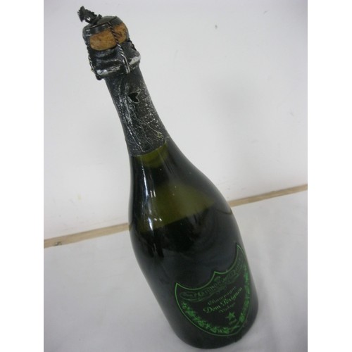 62 - A bottle of Dom Perignon Luminous Label 2010, sealed, luminous label works, storage wear to label an... 