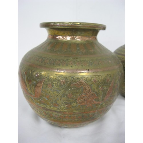 51 - A pair of Indo-Persian engraved brass and copper vases in good order