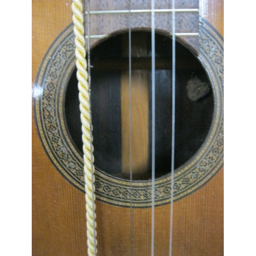 48 - A nylon-stringed classical guitar in good order