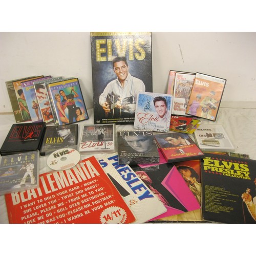 64 - A large box of Elvis records, DVDs etc