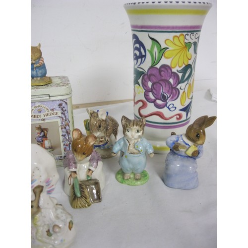 58 - A selection of Frederick Warne Beatrix Potter figures and a Poole Pottery vase, plus a Brambly Hedge... 