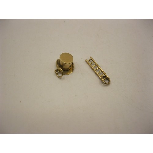 74 - Two 9 carat gold charms - a top hat (approx. 0.8g) and a ladder (approx. 0.45g), each with British h... 