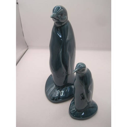 148 - Poole Pottery Dolphin Blue  large and small Penguin in pristine condition .