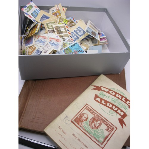 69 - A pair of stamp albums and a box of mixed stamps