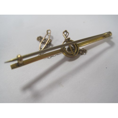 200 - A yellow metal bar brooch with seed pearl mounted to centre, acid tests as 9 carat, safety chain, wo... 