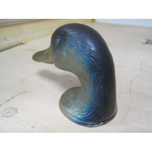 257 - A cast metal bottle opener formed as a mallard duck head, marked 'Ducky' Paris