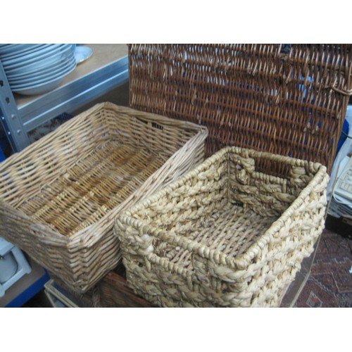 325 - A pair of woven top footstools plus a number of rectangular wicker baskets