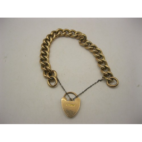 44 - A 9 carat gold hollow-link bracelet with heart-shape clasp and a base metal safety chain. The clasp ... 