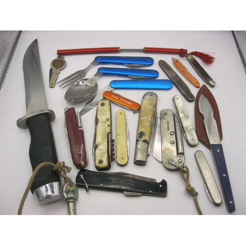 32 - A tin containing a quantity of penknives including a folding knife, fork and spoon set, a military s... 