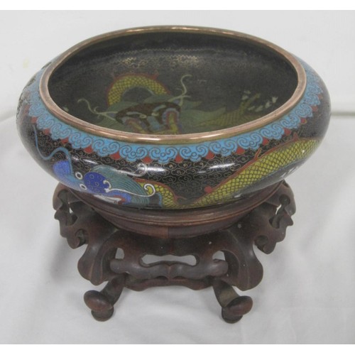 124 - A Chinese cloisonne bowl with dragon decoration on ornate intricate stand