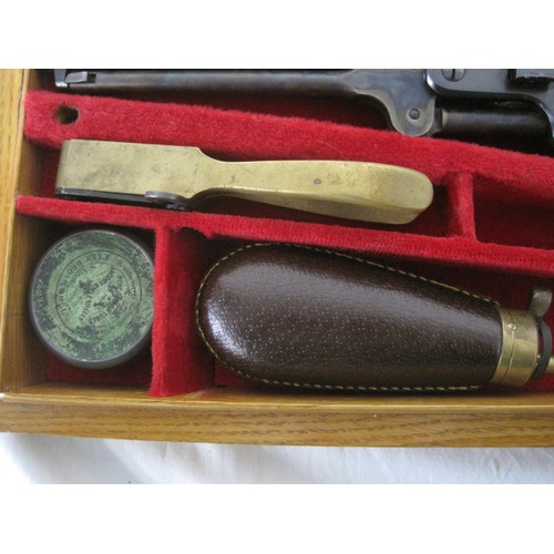 143 - An 1851 Model Colt Navy, cased, matching serial numbers throughout (25511), in original oak case. in... 