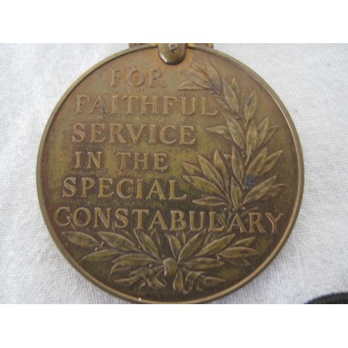 386 - A Special Constabulary Long Service Medal with original ribbon, named to: WILLIAM CAMERON