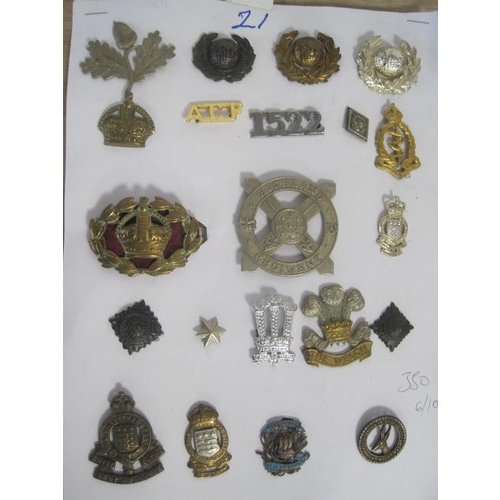 392 - A card of military cap and other badges including Royal Marines, Parachute Regiment, Pioneer Corps e... 