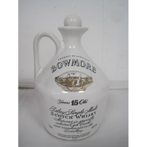 146 - A wooden Grant's Whiskey bottle holder in the form of a barrel, with stand, and a Bowmore ceramic de... 