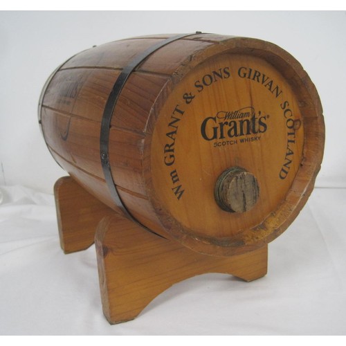 146 - A wooden Grant's Whiskey bottle holder in the form of a barrel, with stand, and a Bowmore ceramic de... 