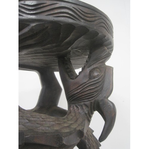 149 - A heavily carved wooden plant or other stand, hardwood