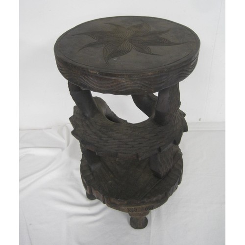 149 - A heavily carved wooden plant or other stand, hardwood