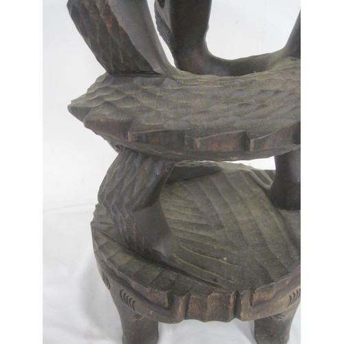 149 - A heavily carved wooden plant or other stand, hardwood