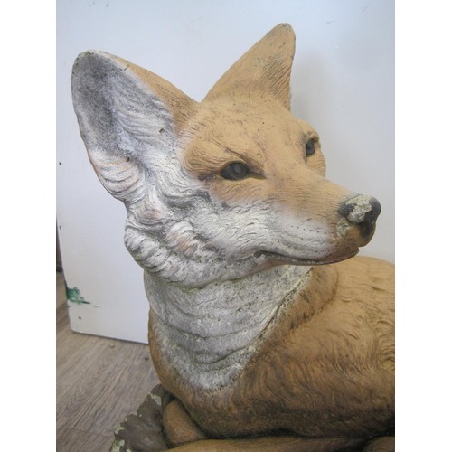 152 - A painted stoneware figure of a naturalistic fox - please note shipping by pallet only as it is very... 