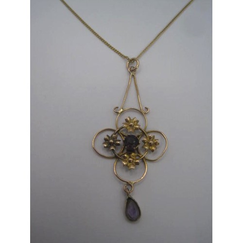 168 - A 9 carat imported gold necklace approx. 1.5g, with foliate drop pendant set with two amethysts, gro... 