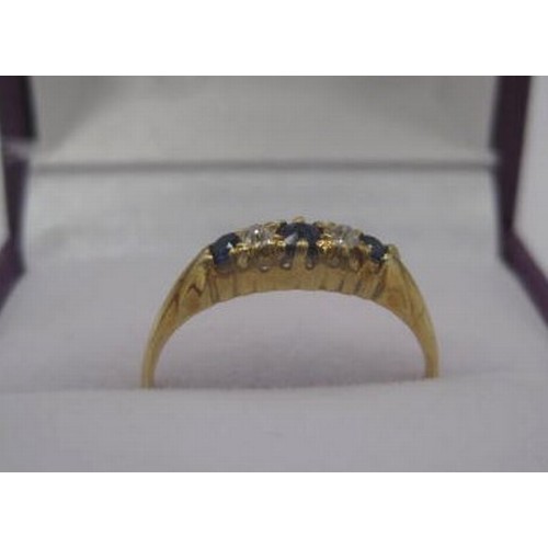 174 - An 18 carat gold sapphire and diamond ring. Ring size K/L, gross weight approx. 1.8g. Set with three... 