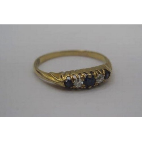 174 - An 18 carat gold sapphire and diamond ring. Ring size K/L, gross weight approx. 1.8g. Set with three... 