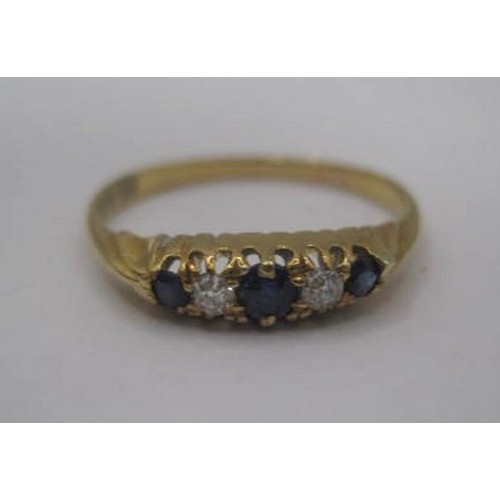 174 - An 18 carat gold sapphire and diamond ring. Ring size K/L, gross weight approx. 1.8g. Set with three... 