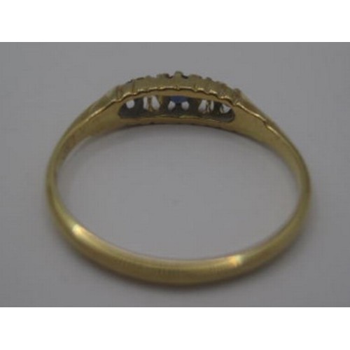 174 - An 18 carat gold sapphire and diamond ring. Ring size K/L, gross weight approx. 1.8g. Set with three... 