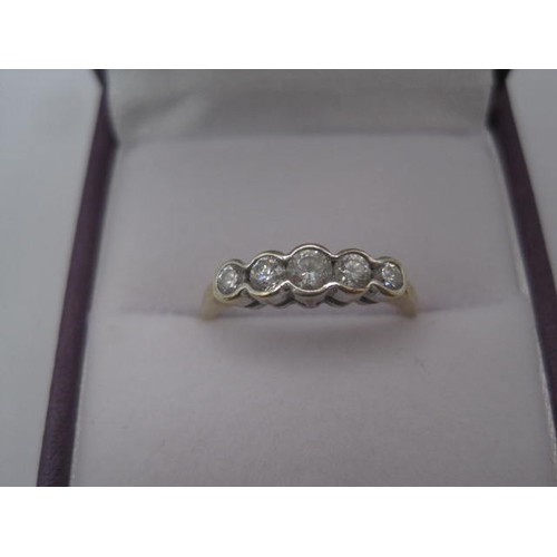 176 - A 9 carat gold five-stone cubic zirconia ring, size M/N, gross weight approx. 1.5g, stamped 375 CZ e... 