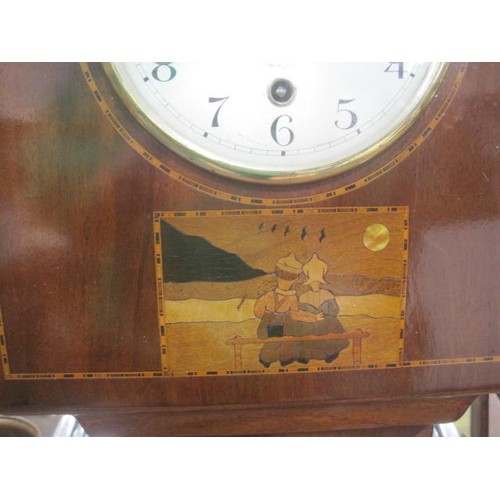 180 - An inlaid mahogany granddaughter clock, the striking movement with the crossed arrow mark of Hamburg... 