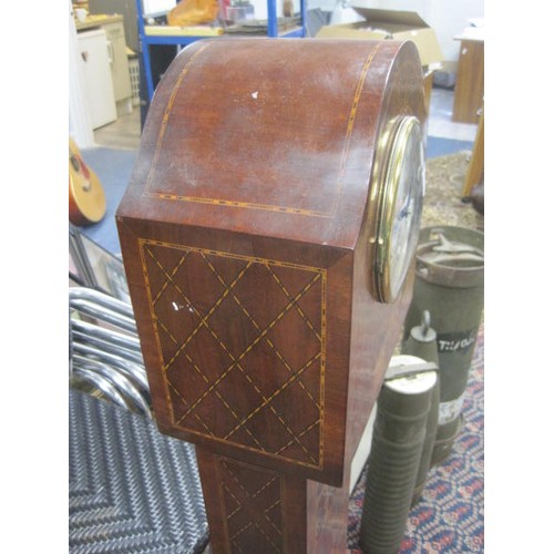 180 - An inlaid mahogany granddaughter clock, the striking movement with the crossed arrow mark of Hamburg... 