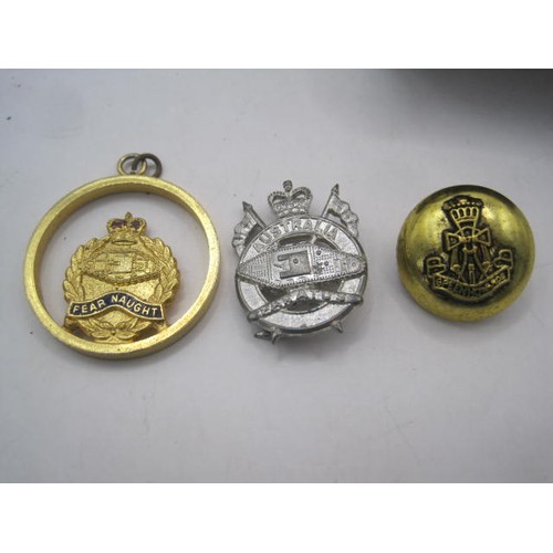 57 - A Green Howards button, a Royal Tank Regiment pendant, and an Australian 1st Armoured Regiment badge... 