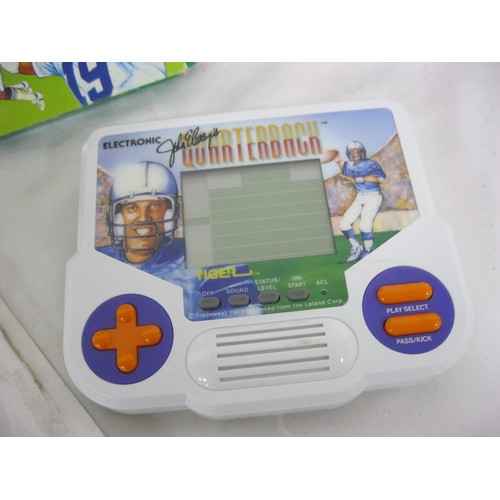 166 - A vintage John Elway's Quarterback LCD Handheld Video Game, opened but with all original packaging, ... 