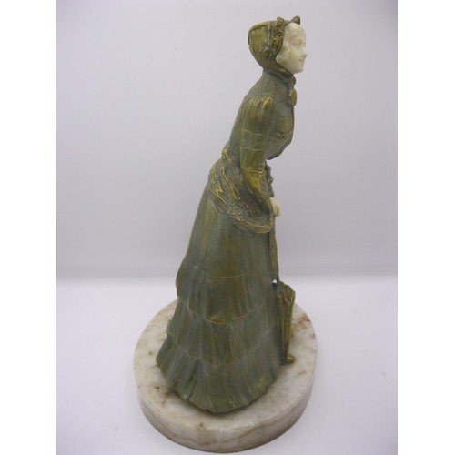 194 - A gilded bronze and carved ivory figure of a young woman on an onyx base, signed to one side Marcell... 